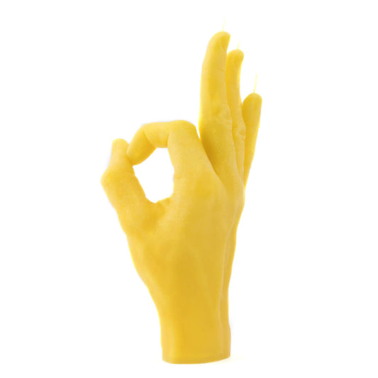 vela em formato de mão amarela com gesto de OK